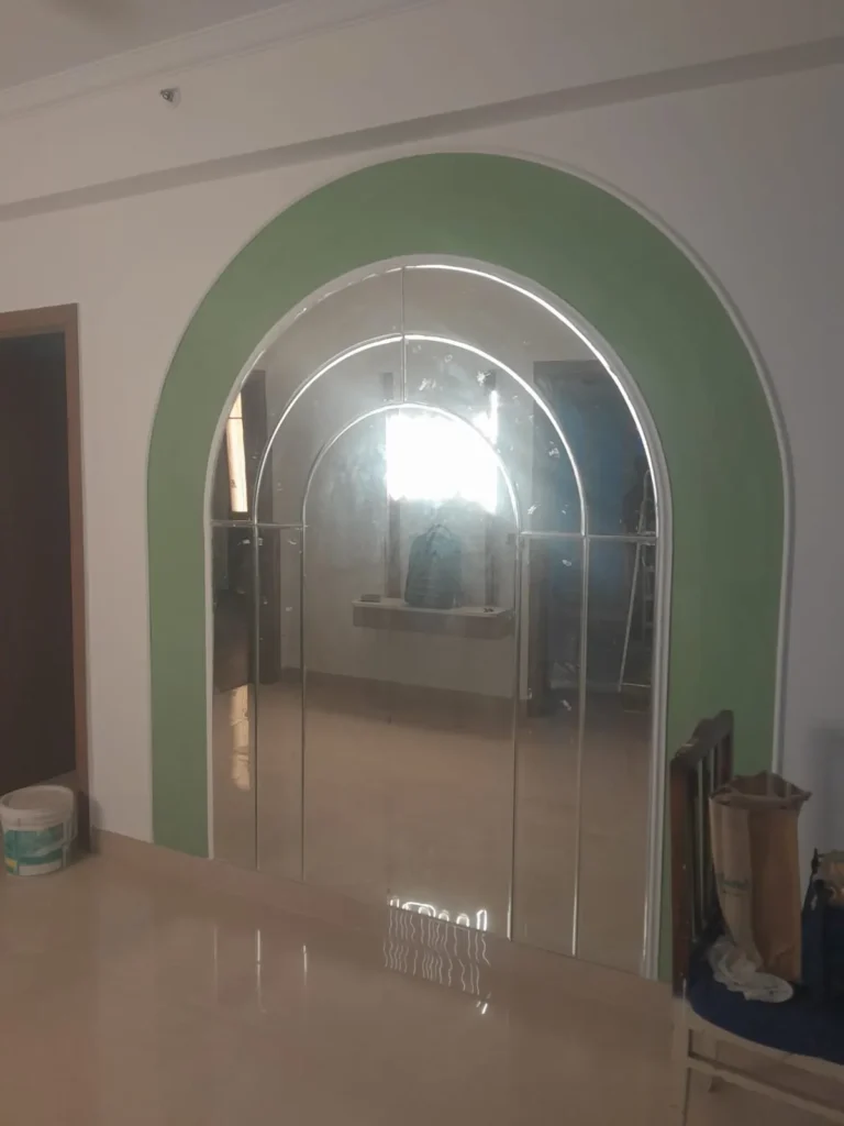 Arched entrance with glass doors in a finished interior
