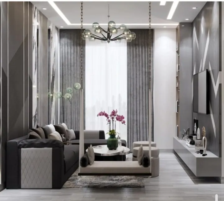 Living room interior design with chandelier and TV wall