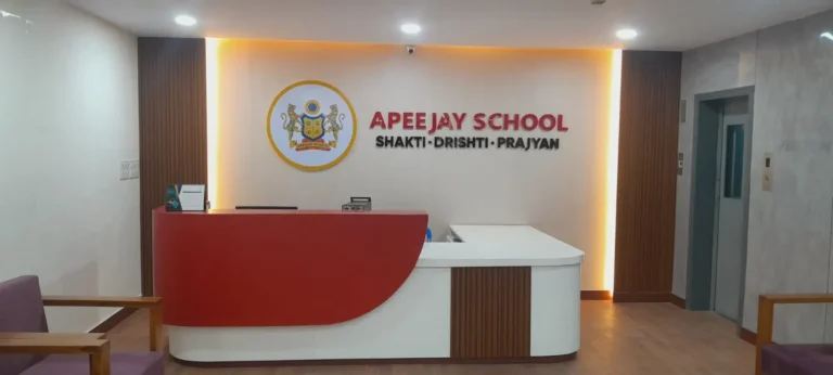 Reception area with custom curved front desk and backlit logo wall