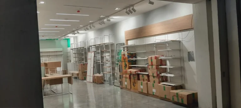Retail showroom fit-out with modular shelving and track lighting